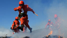 30 firefighters and volunteers die fighting forest fire in China