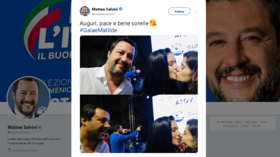 Italy’s Salvini photobombed by kissing lesbian couple… tweets pics in response