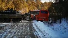 WATCH and enjoy: Russian TANK pulls passenger bus from ditch on icy country road