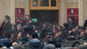 MPs call on Abkhazia’s president to step down after opposition protesters STORM government