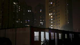 ‘Wuhan, you can do it!’: Quarantined residents sing from their balconies in stirring VIDEOS