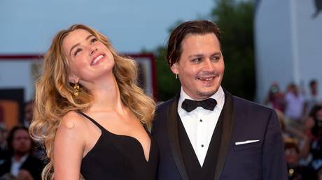 FILE PHOTO: Johnny Depp and Amber Heard attending the 2015 Venice Film Festival © Global Look Press / Hubert Boesl