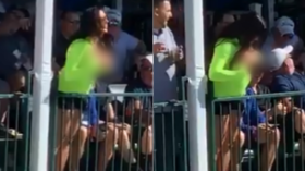 Teat-ing off! Busty spectator halts golf game by baring her breasts during PGA Tour event (VIDEO)