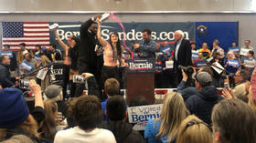 ‘A little bit of excitement at no extra cost’: Sanders quips after TOPLESS anti-dairy protesters steal show at Nevada rally