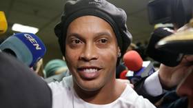 Ronaldinho ARRESTED as judge rejects prosecutor's recommendation to release Brazilian superstar over fake passport claims