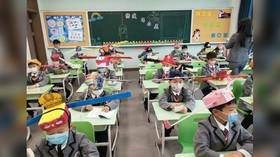 Thinking caps on: Chinese school kids return to classroom with the help of ‘social distancing hats’ (PHOTOS)
