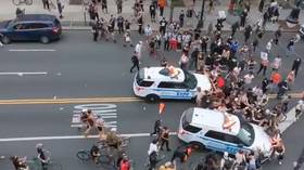 NYPD police cruisers RUN INTO crowds of protesters in terrifying video