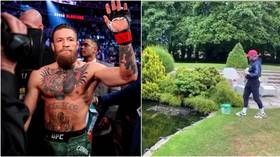 Gardening leave: Conor McGregor feeds fish, practices golf swing as UFC star enjoys 'retirement' at sprawling Irish mansion