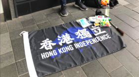 Hong Kong police arrest 1st person under new security law banning independence flags