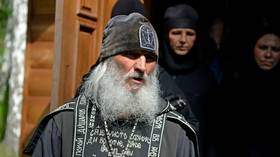 Coronavirus-denying, ex-con Russian priest calls for Putin to step down or face "full-blown spiritual war"
