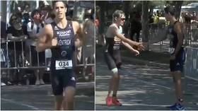 'True class': Triathlete goes viral after incredible moment of sportsmanship (VIDEO)