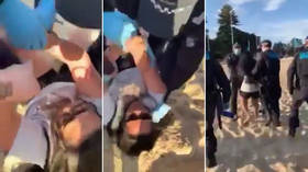 Victoria police filmed handcuffing PREGNANT beachgoer as state authorities consider extending lockdown rules