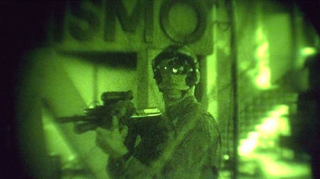 FILE PHOTO: An Australian soldier is seen through night vision while on patrol in Dili, East Timor.