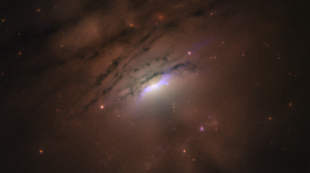 Black hole’s structure possibly glimpsed as dust ring casts shadows and rays far across space