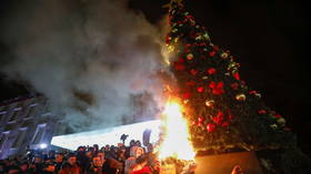 Cheering Albanians torch Christmas tree amid fiery protests in capital over police killing of Covid curfew-breaker (VIDEOS)