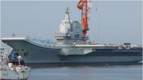 China sends aircraft carrier through Taiwan Strait just day after 'flirtatious' transit by US warship