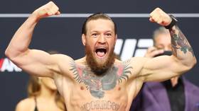 WATCH: Conor McGregor and Dustin Poirier hit the scale at the UFC 257 official weigh-ins (VIDEO)
