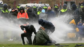 Woman knocked over & left bleeding after water cannon fires from close range during anti-lockdown protests in Netherlands (VIDEO)