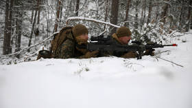 Frosty relations: US Marines equipped for Arctic warfare land near Russian-Norwegian border as tensions heat up in frozen North
