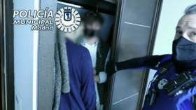 Madrid police shows VIDEO of crackdown on Covid-rule-breaking teen party, with scared guests snatched from inside wardrobes & beds
