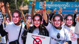 Myanmar’s ousted leader Suu Kyi is seen for first time in weeks & now faces new charges, as anti-coup protests rage on