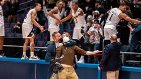 March MADNESS: Row breaks out over ‘one of the most bizarre sports photos’ after security guard puts cameraman in ‘chokehold’
