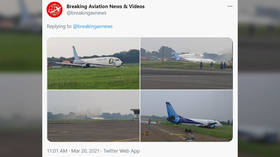 Boeing 737 cargo plane skids off runway into field during hard landing in Indonesia (VIDEO)