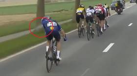 Tour de France fan who caused 21 injuries by triggering mass crash with sign is now being HUNTED BY POLICE (VIDEO)