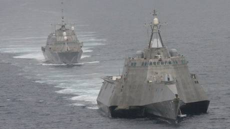 USS Freedom (rear), and USS Independence (front) maneuver together during an exercise off the coast of California, May 2012