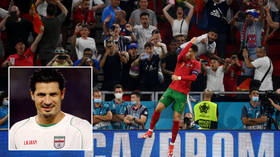 Ronaldo pelted with Coca-Cola bottle before pitch invader reaches him... and goals legend Ali Daei hails ‘caring humanist’ (VIDEO)