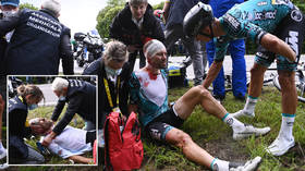 ‘Is being a dumb*ss an arrestable offence?’: Row breaks out after woman is ARRESTED for causing Tour de France pileup (VIDEO)