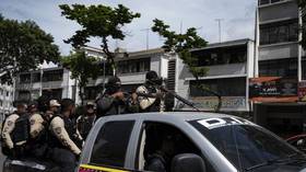 3 reported dead in Caracas gun battles as Venezuelan police fight gangs seeking to expand territory (VIDEOS)