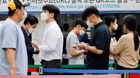 As South Korea’s Covid-19 infections break records, Seoul re-imposes maximum social distancing rules