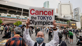Japanese PM Suga says record number of Covid cases ‘not a problem’ for the Olympics despite growing pressure