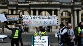 Mass protests kick off in Paris after France’s constitutional court approves controversial Covid legislation (VIDEOS)