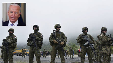 Members of the KFOR peacekeeping force patrol the area near the border crossing between Kosovo and Serbia in Jarinje, Kosovo, October 2, 2021. © REUTERS / Laura Hasani; (inset) Joe Biden © REUTERS / Evelyn Hockstein
