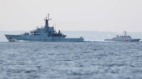FILE PHOTO. French military vessels are seen in the English Channel on the French side of the border between Calais and Dover, Britain.