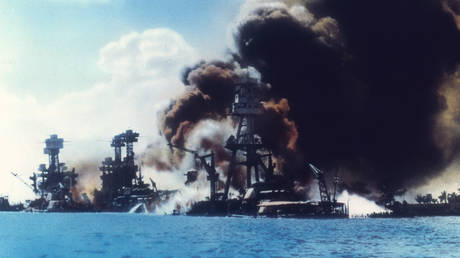 View of battleship row as explosions damage three American battleships during the Japanese attack on Pearl Harbor, Honolulu, Oahu, Hawaii, December 7, 1941. © US Navy / Interim Archives / Getty Images