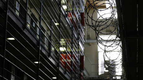FILE PHOTO: Barbed wire is seen inside the east block of death row at San Quentin State Prison, in San Quentin, California, August 16, 2016.