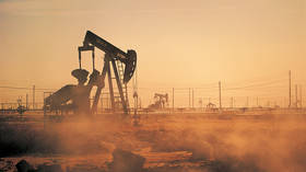 Oil edges toward $100 per barrel