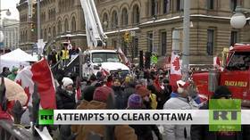 ‘The whole world’s watching’ – Ottawa protesters speak to RT