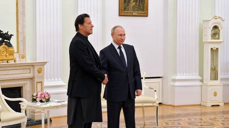 Russian President Vladimir Putin and Pakistani Prime Minister Imran Khan shake hands during a meeting in Moscow, February 24, 2022