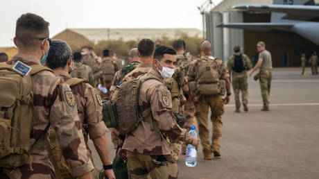 French Barkhane force soldiers who wrapped up a four-month tour of duty in the Sahel board a US Air Force C130 transport plane, leave their base in Gao, Mali Wednesday June 9, 2021.