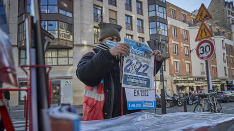 FILE PHOTO. Newspaper seller sets up his stand in Paris, France. ©Kiran Ridley / Getty Images
