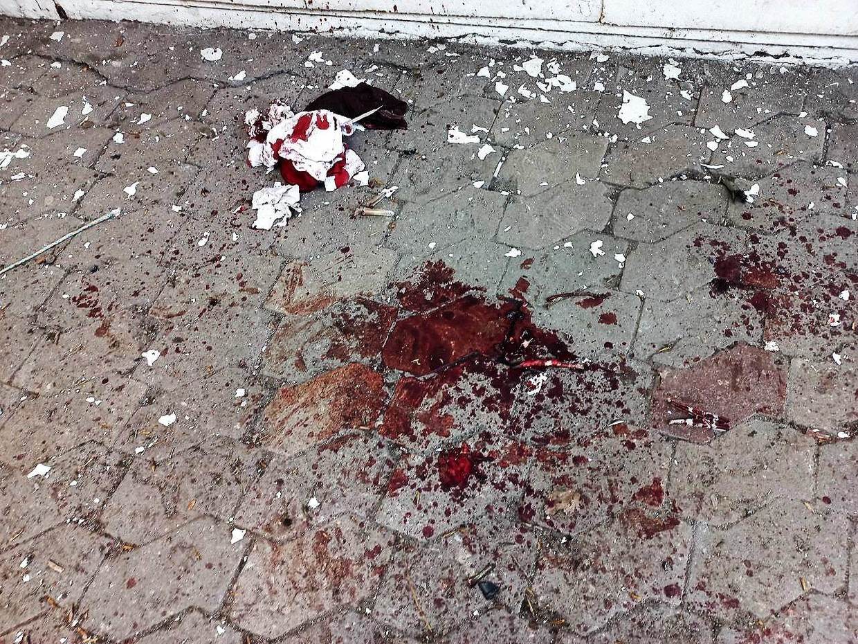 Blood on the ground at the site of the Ukrainian strike in the Donetsk marketplace. Photo: Eva Bartlett
