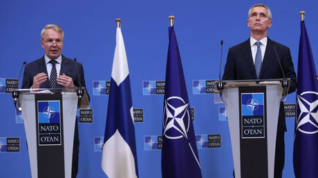 NATO Secretary-General Jens Stoltenberg (R) and Finnish Foreign Minister Pekka Haavisto are shown speaking to reporters in Brussels after a meeting in January.