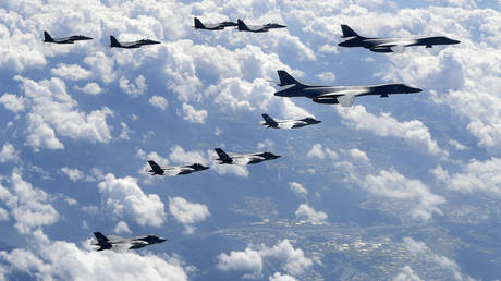 FILE PHOTO: US Air Force B-1B bombers, F-35B stealth fighter jets and South Korean F-15K fighter jets fly over the Korean Peninsula during joint drills in September 2017.