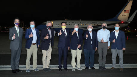 US senators with Taiwan Foreign Minister Joseph Wu (4th-L) after arriving at the Sungshan Airport in Taipei on April 14, 2022. © Handout / AFP