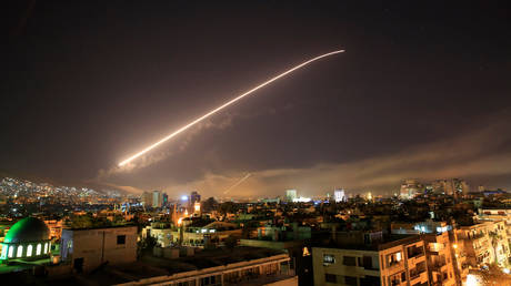 FILE PHOTO: Air defense missiles are seen over Damascus