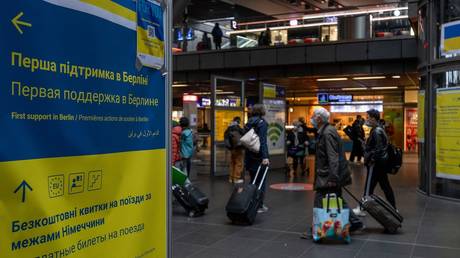 FILE PHOTO: A poster with information for refugees arriving from Ukraine hangs at Berlin's central train station, Berlin, Germany, on April 15, 2022.